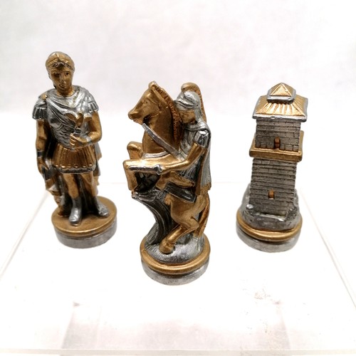 294 - A continental metal chess set largest piece 8cms, complete with chess board box 40 cms in diameter, ... 