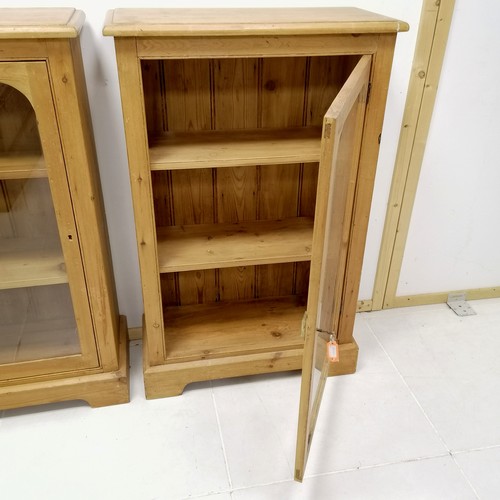 296 - Pair of pine glazed floor cabinets with keys 107cm high x 68cm wide x 30cm deep. Both in good used c... 