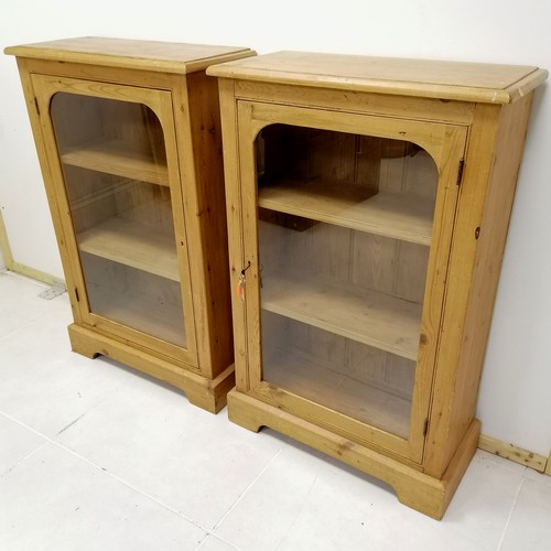 296 - Pair of pine glazed floor cabinets with keys 107cm high x 68cm wide x 30cm deep. Both in good used c... 