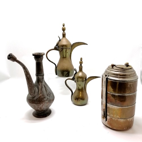 297 - Collection of Syrian brass and copper jugs and a food carrier tallest  36cm high