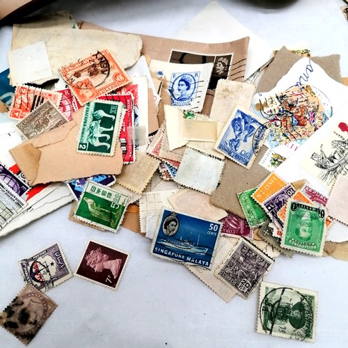 427 - Collection of various stamps, some in 2 albums and a tin of various loose stamps.