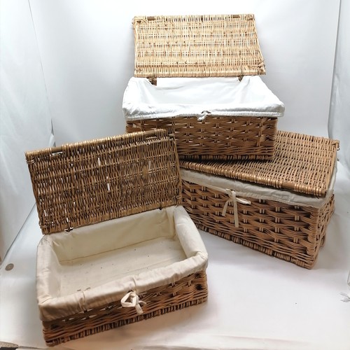 454 - Set of 3 wicker hampers lined with white cotton largest 53cm x 37cm x 24cm high. All in good used co... 