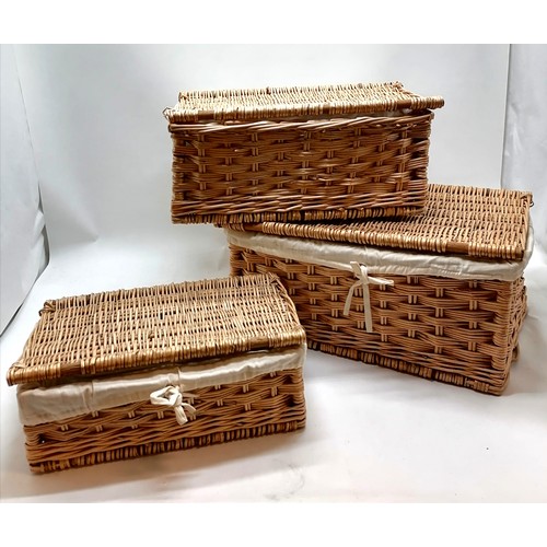 454 - Set of 3 wicker hampers lined with white cotton largest 53cm x 37cm x 24cm high. All in good used co... 