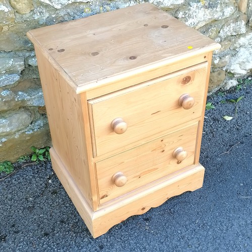 469 - Pine 2 drawer side cabinet/ bedside table. 50cm x 42cm x 60cm. In overall good used condition.