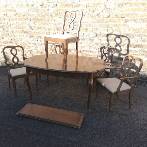 475 - Oval extending dining table and 6 chairs. 105cm x 150cm (closed) x 77cm high.