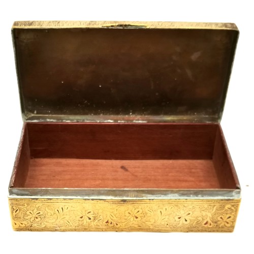 507 - A Brass oval tray, 68 cm x 52 cm t/w embossed tray, Indian brass cigarette box and a bell.