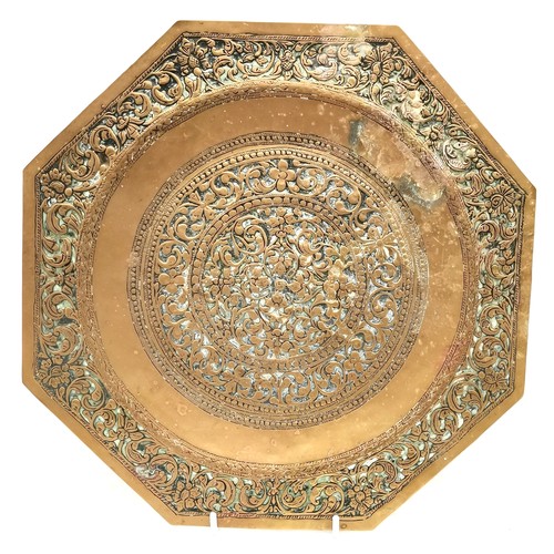 507 - A Brass oval tray, 68 cm x 52 cm t/w embossed tray, Indian brass cigarette box and a bell.