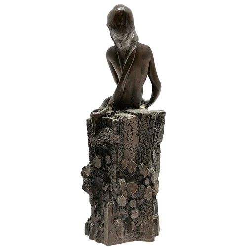 508 - A Bronzed resin figure of a reclining nude on rocky base 15.5 cm high 5 cm diameter by Giovanni Scho... 