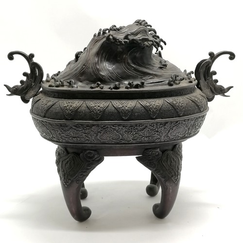 14 - Large Oriental bronze censor with wave decoration to the lid and stylised dolphin handles, signed wi... 