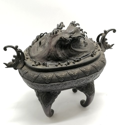 14 - Large Oriental bronze censor with wave decoration to the lid and stylised dolphin handles, signed wi... 