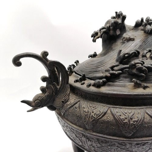 14 - Large Oriental bronze censor with wave decoration to the lid and stylised dolphin handles, signed wi... 