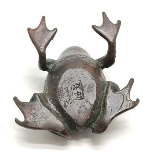 37 - Antique oriental bronze frog figure with marks to belly - 4cm across