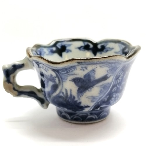 41 - Antique Oriental blue & white small teacup with marks to base - 3cm high ~ has losses of glaze to th... 