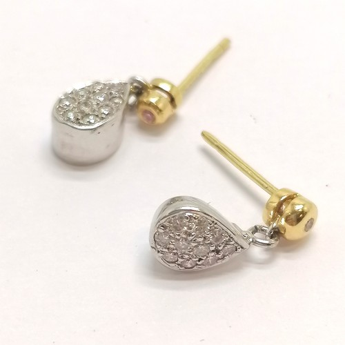 641 - Pair of 18ct white and yellow gold hallmarked diamond set earrings as teardrops, set with total of 2... 