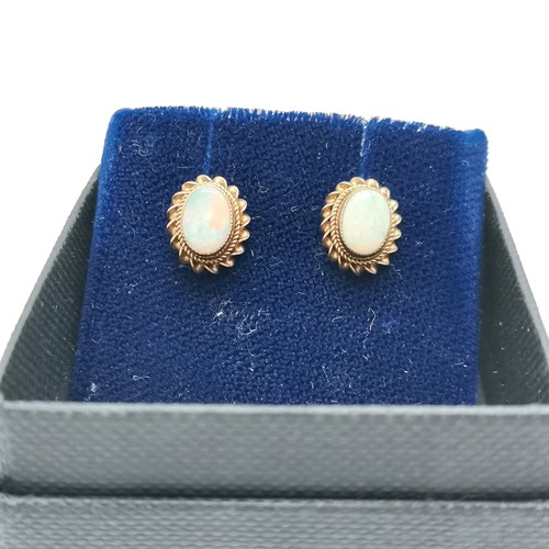 685 - 9ct hallmarked gold opal earrings (1.7g total weight) t/w 14ct marked gold sapphire stone set earrin... 