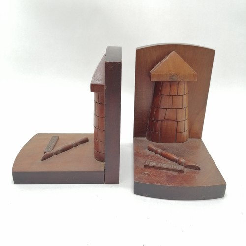 144 - Pair of carved mahogany bookends from Barbados 16cm high