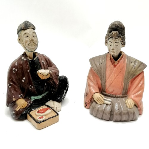 147 - Pair of ceramic seated oriental nodding figures 18cm high - both have losses to the paint and male A... 