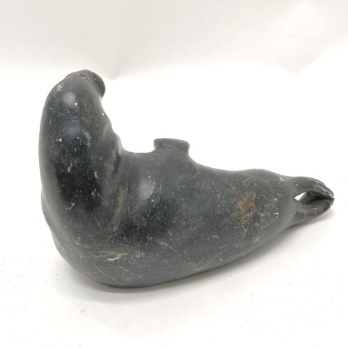 164 - 2 Inuit stone carvings of a seal and a walrus both 13cm long with signature and numbers to the bases