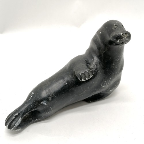 164 - 2 Inuit stone carvings of a seal and a walrus both 13cm long with signature and numbers to the bases