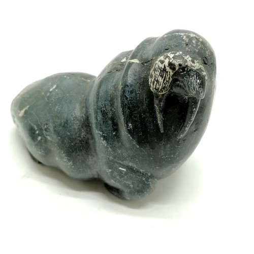 164 - 2 Inuit stone carvings of a seal and a walrus both 13cm long with signature and numbers to the bases