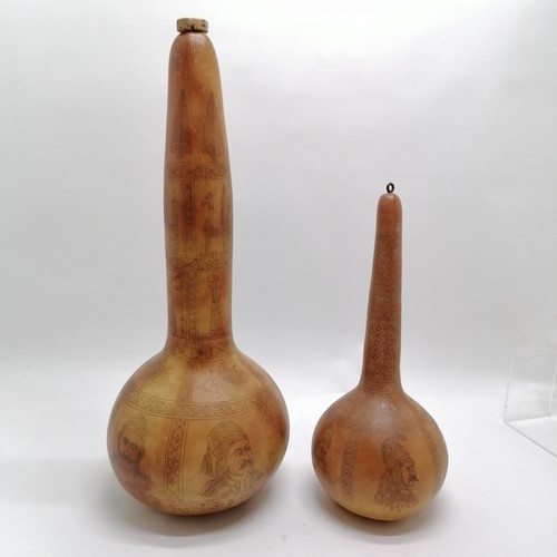 187 - 2 x Cyprus decorated gourds - tallest 48cm & has crossed swords and gun detail and portraits and a g... 