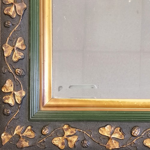 258 - Antique bevelled mirror with shamrock detail to frame - 50cm x 43cm ~ slight losses to frame