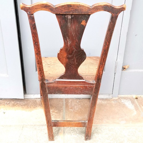 267 - Antique carved oak hall chair 86cm high x 36cm deep - has a split to the seat