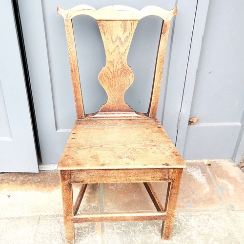 267 - Antique carved oak hall chair 86cm high x 36cm deep - has a split to the seat