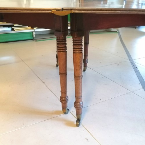 271 - An antique Mahogany D end extending Dining Table with 2 extending leaves, on turned column legs. 212... 