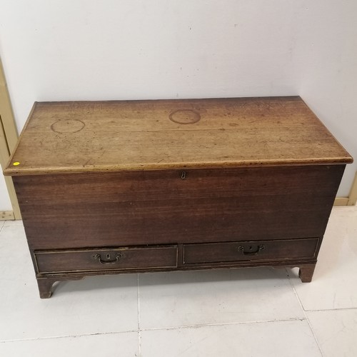 279 - An Antique oak Mule chest, interior fitted with candle box, on bracket shape feet, 109 cm in width, ... 