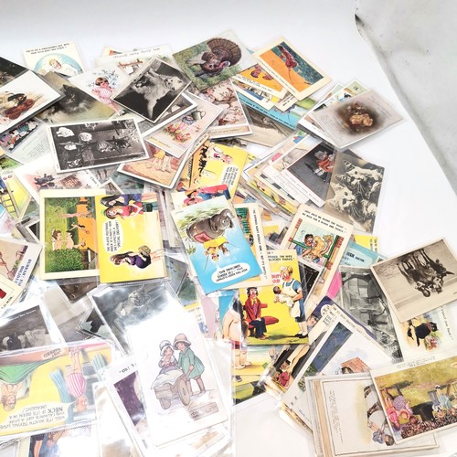 292 - Ex dealers lot of postcards mostly comic & children related with a few foreign & animals - priced up... 