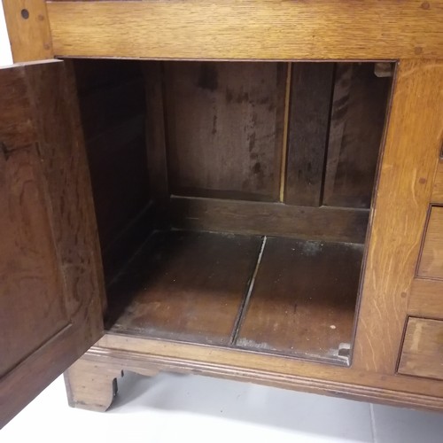 306 - An Antique oak dresser with three tier delft rack, the base having 6 short drawers and 2 cupboards, ... 