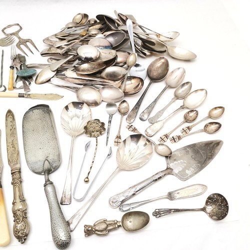 313 - A large collection of silver plated assorted flatware, to include crumb tray, cake knife, teddy chri... 