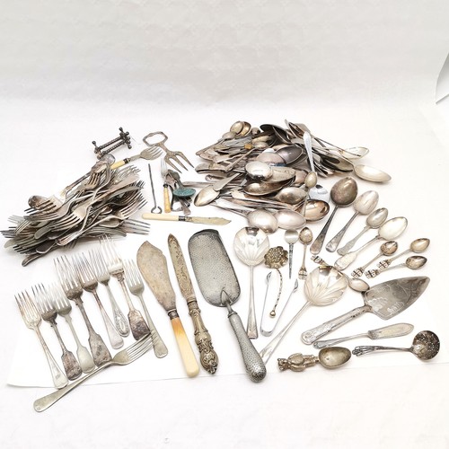 313 - A large collection of silver plated assorted flatware, to include crumb tray, cake knife, teddy chri... 