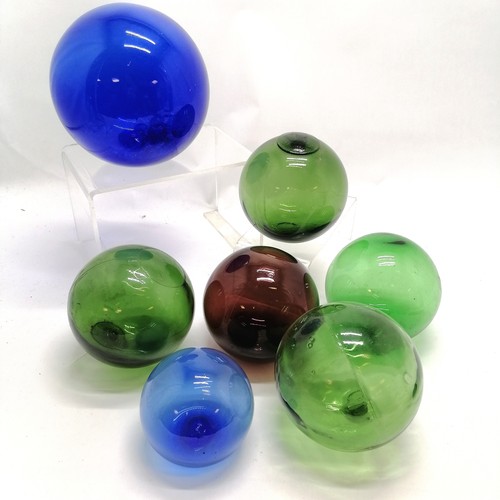 315 - 7 x coloured glass fishing floats - largest 16cm diameter