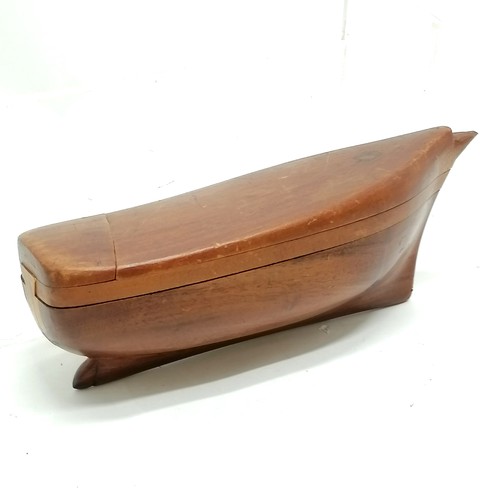 387 - Treen puzzle box in the form of a ships hull - approx 19cm long