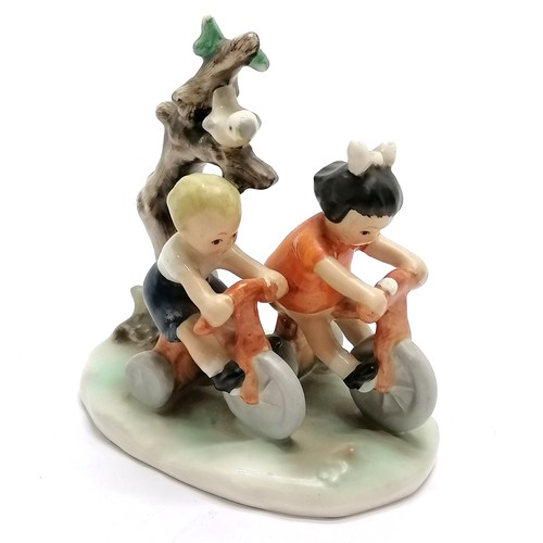 403 - Goebel figure of 2 children riding tricycles GF102 - 11cm high with no obvious damage