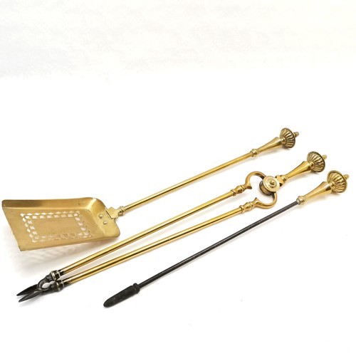 423 - Antique brass companion set, with reeded decoration to handles, comprising of tongs, poker and shove... 