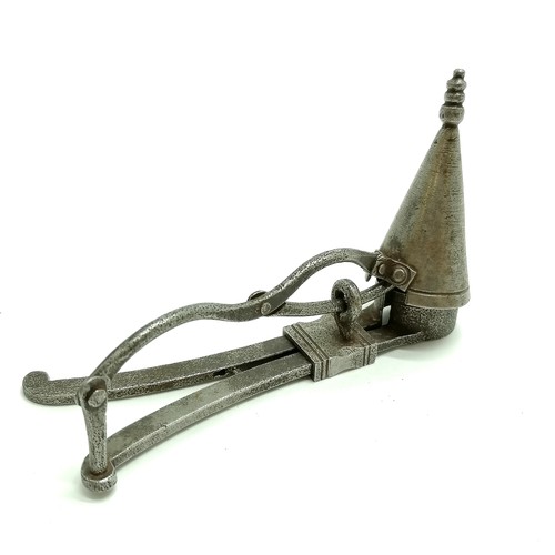 428 - Antique steel combination candle snuffer/prick with a grip mechanism total length 22cm