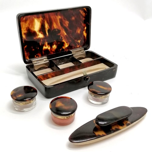 432 - Antique tortoiseshell box containing tortoiseshell and silver topped jars and a nail buffer, box 12c... 