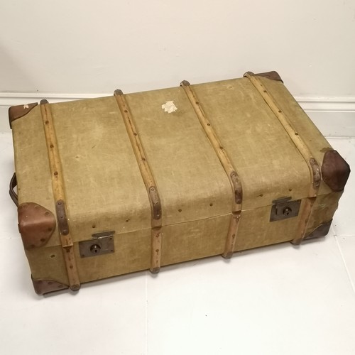 446 - Antique wooden banded and green canvas trunk with leather corners 55cm x 32cm x 92 cm long- In overa... 