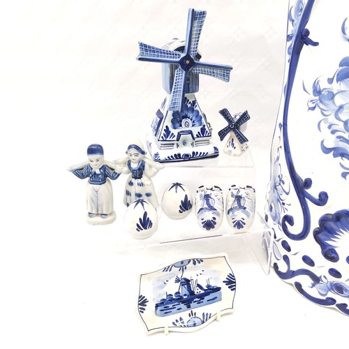 476 - A Portuguese blue and white decorated umbrella stand 46 cm high x 20 cm diameter t/w assorted Delft ... 