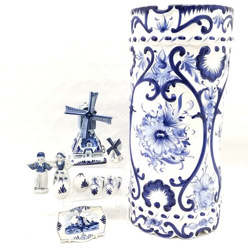 476 - A Portuguese blue and white decorated umbrella stand 46 cm high x 20 cm diameter t/w assorted Delft ... 