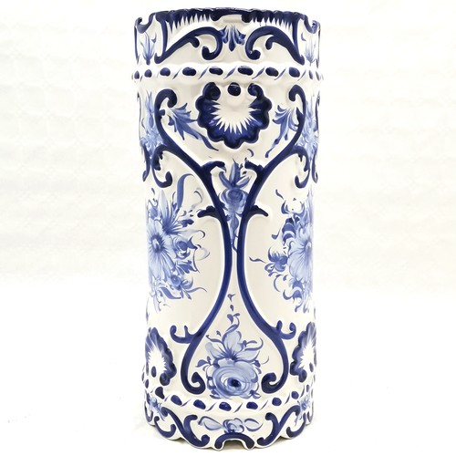 476 - A Portuguese blue and white decorated umbrella stand 46 cm high x 20 cm diameter t/w assorted Delft ... 