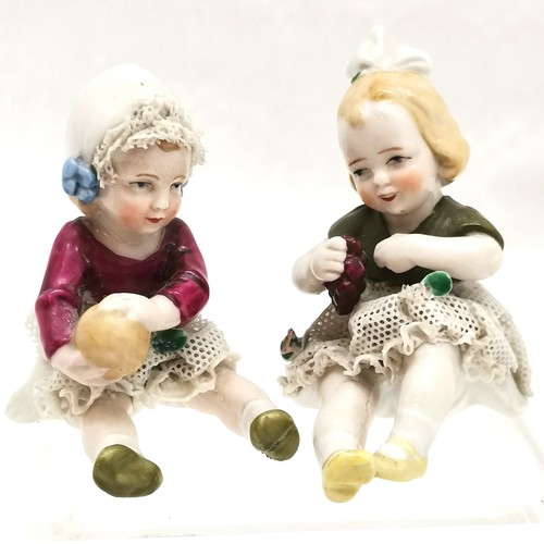 517 - Victorian fairing, Children's meeting 10cm high x 9 cm wide, t/w pair of German child figures with n... 