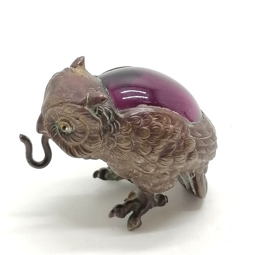 528 - Novelty brass owl pocket watch holder with amethyst glass detail to back (3.5cm & lacks base, 2 toes... 