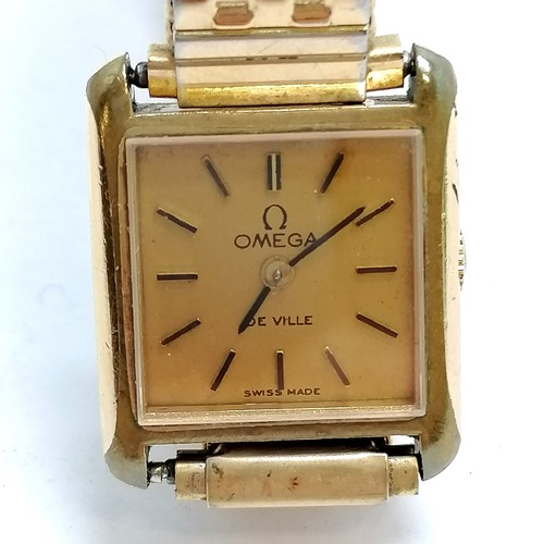 937 - Ladies Omega deville with manual wind in a gold plated case - has scratches to the side and runs BUT... 