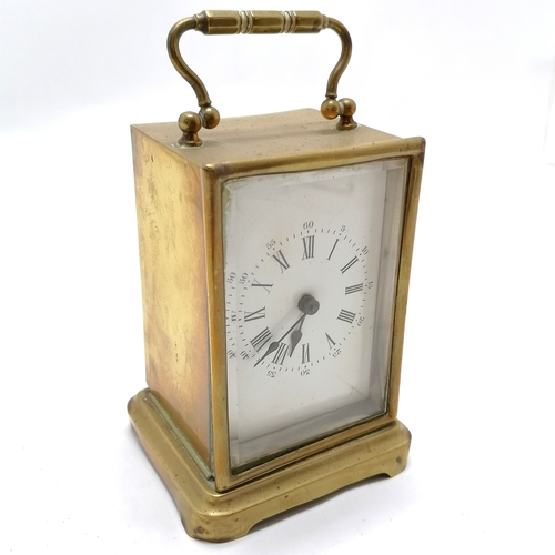 939 - Brass cased carriage clock with ceramic dial 15cm high - missing it's back and crack to dial