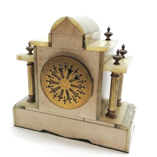 940 - Antique onyx and gilt metal mounted continental mantle clock with key. 28cm x 26.5cm high. Running