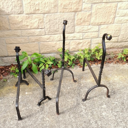 18 - Pair of Forged Fire dogs 67 cm high x 48 cm length t/w similar but smaller 41 cm high x 53 cm length... 